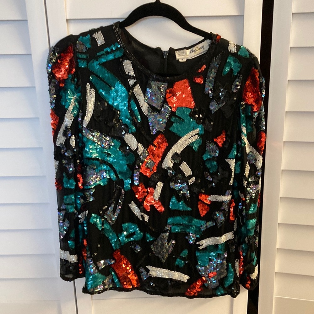 Beaded top. Long sleeve.